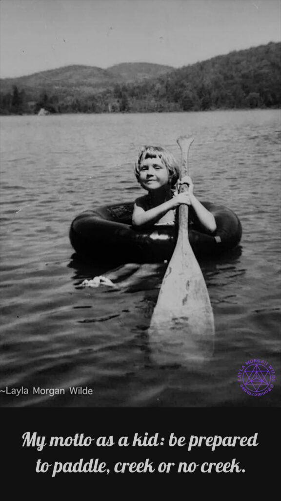Black and white vintage photo girl paddling on a
