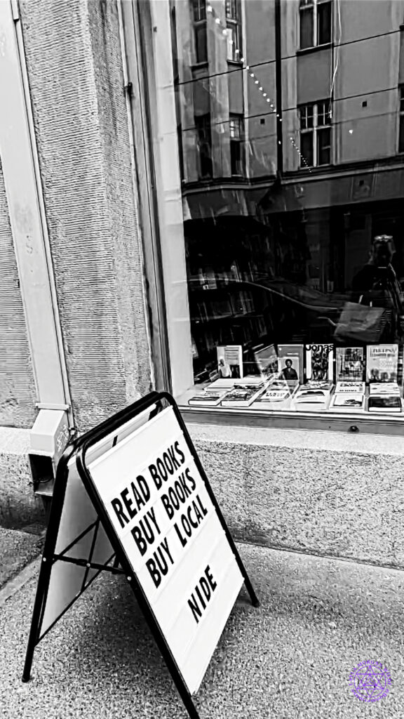 Sign outside of a bookstore read books buy books